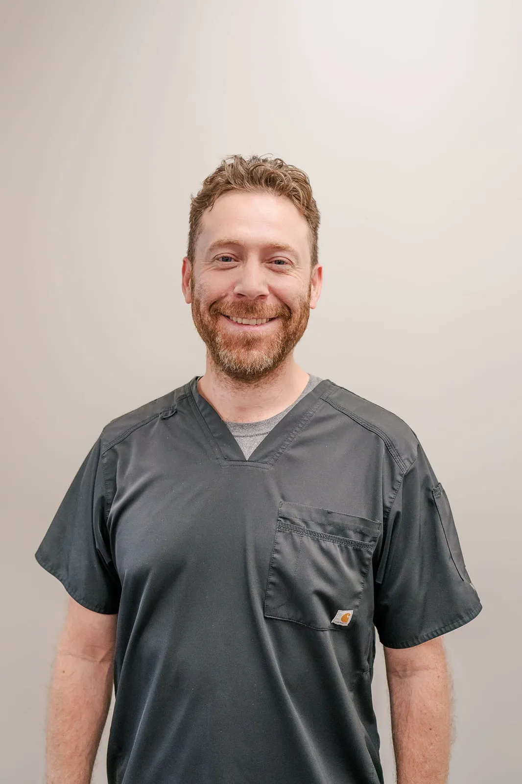 Full-length portrait of Carlos “Christian” Cueva, MD